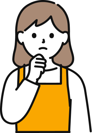 悩んでいるエプロンをつけた女性